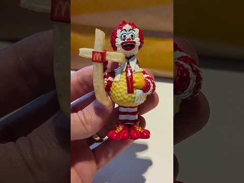 Using Bignald's fry crucifix toy to bless McDonald's french fries 🍟