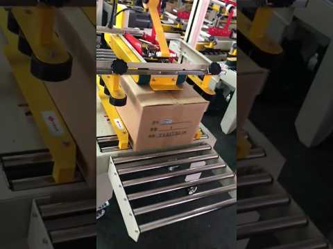 Carton box taping machine