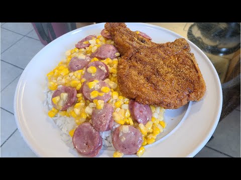 New Orleans Cream Style Corn over rice with a Fried Pork Chop on da side