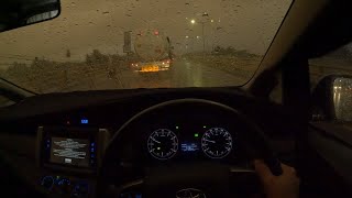 Driving in heavy rain in the city towards evening for sleep, work, study