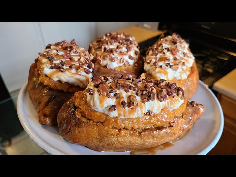 Twice baked Sweet Potatoes | Baked sweet potatoes with whipped cream pecans and caramel on top.