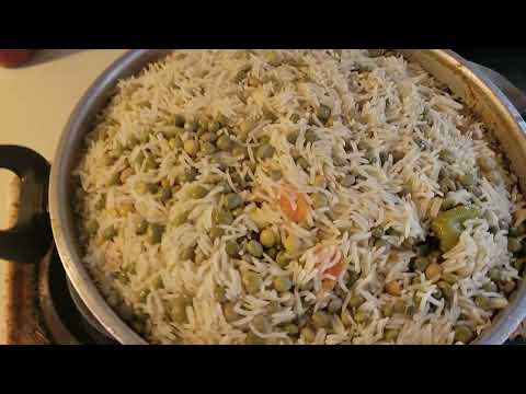 Haitian Rice and Green Peas recipe with green onions, onions, wet seasoning, water, and jasmine rice