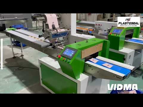 Flow wrapping machine