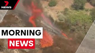 California wildfire disaster, Queensland wild weather, Police officer hospitalised | 7NEWS