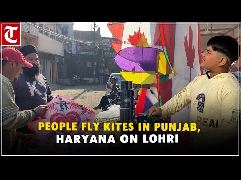 People fly kites on occasion of ‘Lohri’ festival in Punjab, Haryana