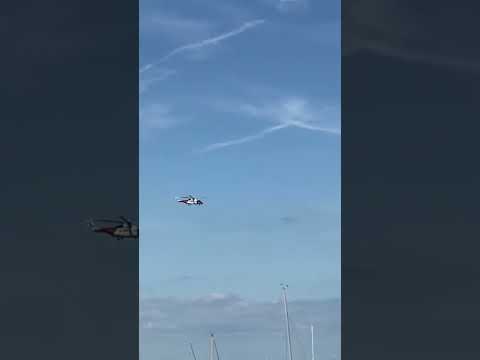 Coastguard chopper over brixham harbour