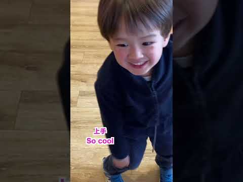 3 years old boy dances at the souvenir shop