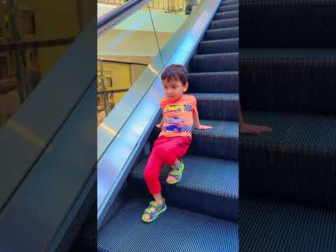 Funny🤩❤️😍 little guy sitting on #escalator and playing😀😂🤩