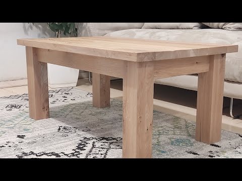 Coffee table with bulky frame and brushed oak top