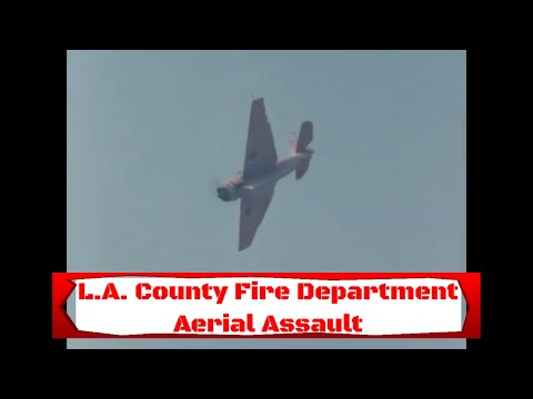 1960s LOS ANGELES COUNTY FIRE FIGHTING AIRCRAFT VS. WILDFIRE   FIREBRAKE RETARDANT DROPS SM10605