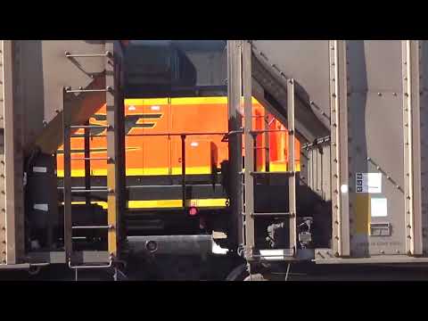 Amazing lashup BNSF 3020, 2519, 166, 2043 passes a coal train in Lincoln, NE