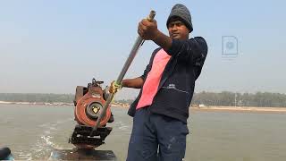 The sailor drives the boat in the sea at Talsari, Odisha