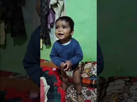 kid playing on bed