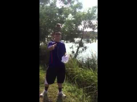 Lim kok Wah throwing bottle into river