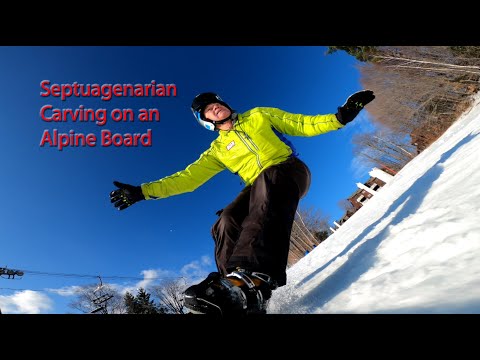 Septuagenarian carving on an Alpine Board