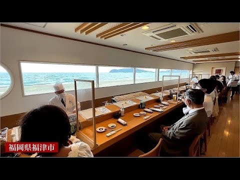 Japanese sushi stall in front of the sea