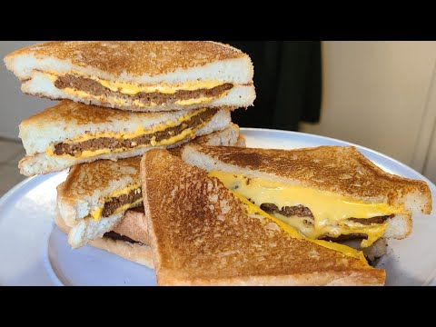 Hot Sausage stuffed Grilled Cheese Sandwiches | Grilled cheese sandwiches with a New Orleans twist.