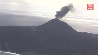 Volcanic island erupting and growing