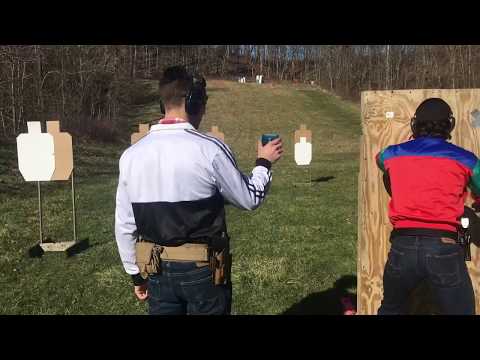 very serious men in tracksuits shoot a very serious USPSA match