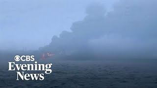 Oil tanker and cargo ship collide, causing fiery explosion