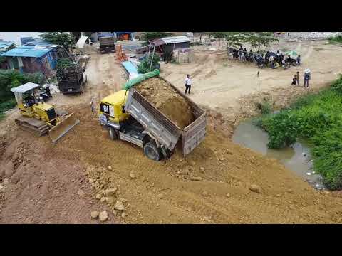 Bulldozer skill!! New side fill land KOMATSU D31 pour stone delete trash & train unload dump truck