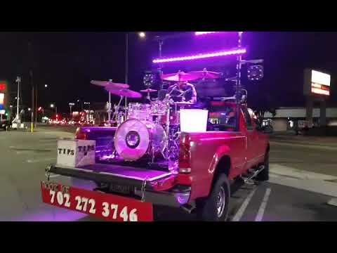 A Guy Playing Drums Outside A Supermarket During The Lockdown