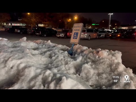 Mounds of snow block handicapped parking spots at Cincinnati shopping center