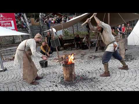 iron smelting in bloomery furnace, extraction and compaction of iron bloom