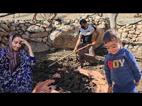 Nomadic life in Iran: the mountain man repairs the place of the sheep