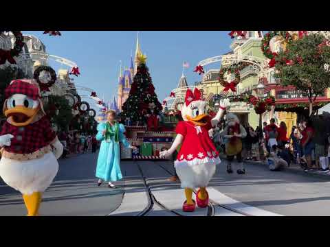 Mickey and friends comes down Main Street in the Christmas Parade Float