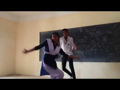 girl and boy dancing together in schol