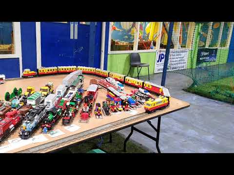 Long lego 7740 on huge layout  running past Lego train colection