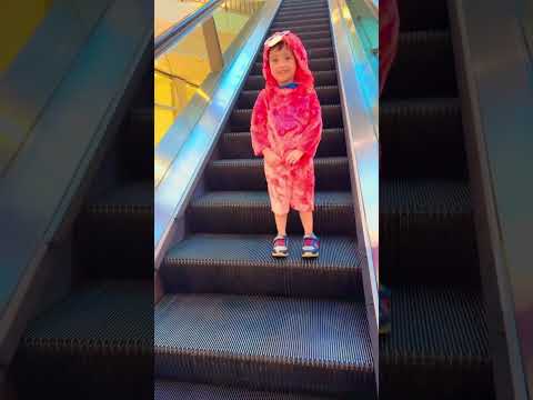 Precious baby😂navigating the #escalator with confidence😨😍