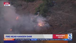 Firefighter pounce on brush fire in San Fernando Valley